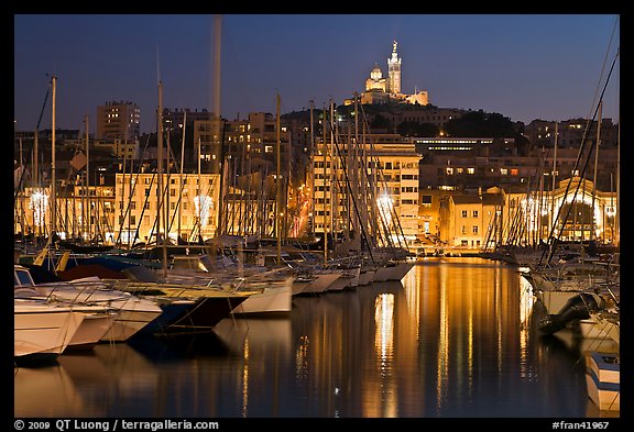 Harbor and Notre Dame de la Garde Basilic on hill. Marseille, France