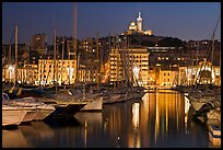 Harbor and Notre Dame de la Garde Basilic on hill. Marseille, France