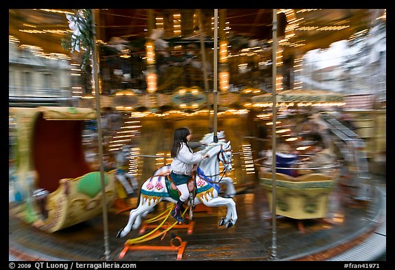 Girl on horse carousel. Avignon, Provence, France (color)