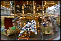 Girl on horse carousel. Avignon, Provence, France