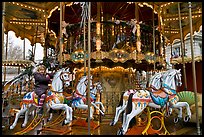 Girl on merry-go-round. Avignon, Provence, France