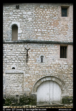 Facade detail of medieval house with small windows, Provins. France (color)