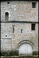 Facade detail of medieval house with small windows, Provins. France