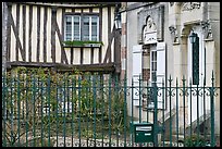 Fence, stone house, and half-timbered house, Provins. France ( color)