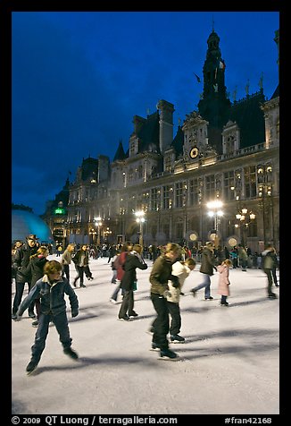 Holiday skaters, Hotel de Ville by night. Paris, France