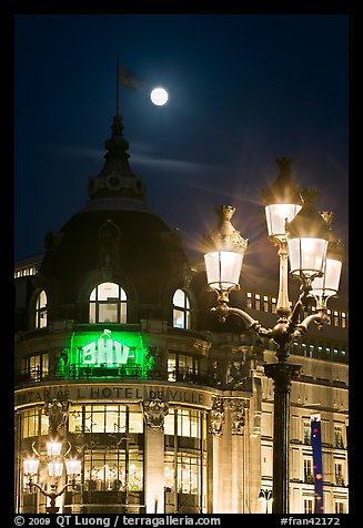 Street lamps, BHV department store, and moon. Paris, France (color)