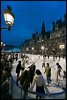 Holiday skating rink at night, City Hall. Paris, France