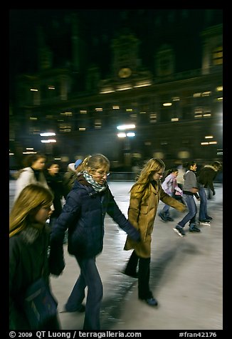 Girls skating by night, Hotel de Ville. Paris, France (color)