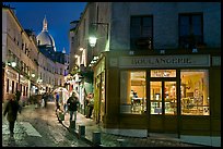 Bakery, street and dome of Sacre-Coeur at twilight, Montmartre. Paris, France (color)