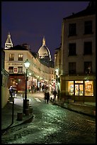 Street and Sacre-Coeur dome at night, Montmartre. Paris, France (color)