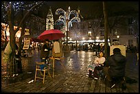 Place du Tertre by night with Christmas lights, Montmartre. Paris, France (color)