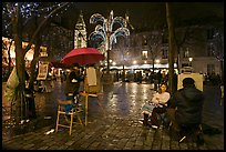 Place du Tertre by night with Christmas lights, Montmartre. Paris, France