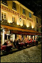 Restaurant with outdoor sitting by night, Montmartre. Paris, France ( color)