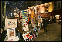 Art for sale on Place du Tertre at night, Montmartre. Paris, France