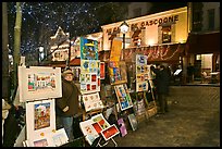 Art for sale on Place du Tertre at night, Montmartre. Paris, France (color)