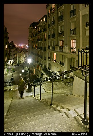 Woman on stairs by night, Montmartre. Paris, France (color)