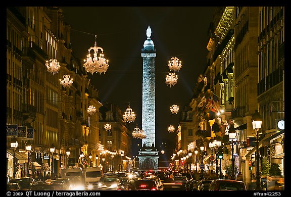 Street with lights and Place Vendome column. Paris, France