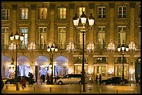 Lights and palace-like classical fronts of Hotel Ritz by Jules Hardouin-Mansart. Paris, France (color)