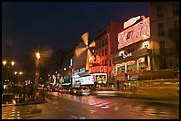 Boulevard by night with Moulin Rouge. Paris, France (color)