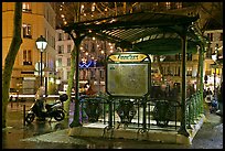 Subway entrance with art deco canopy by night. Paris, France ( color)