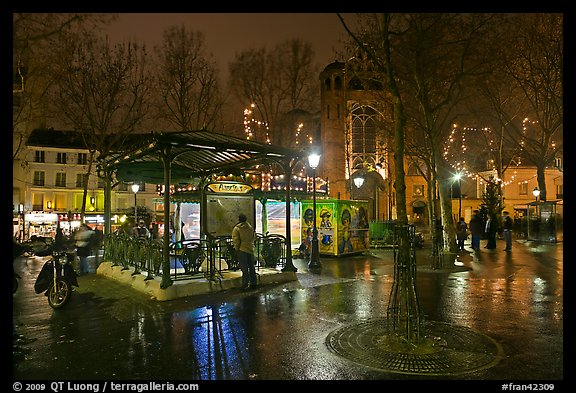 Public square on rainy night. Paris, France (color)