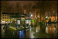 Public square on rainy night. Paris, France