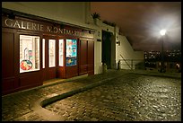 Gallery, street light, and coblestone pavement, Montmartre. Paris, France (color)