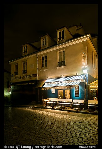 Houses with restaurant at street level, Montmartre. Paris, France