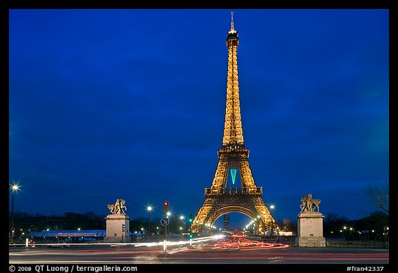 Eiffel Tower seen across Iena Bridge at night. Paris, France