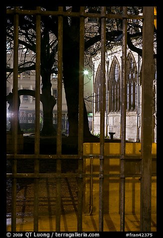 Cluny thermes behind iron grids by night. Quartier Latin, Paris, France (color)