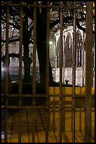 Cluny thermes behind iron grids by night. Quartier Latin, Paris, France