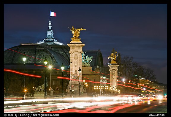 Petit Palais and trafic across Alexandre III bridge by night. Paris, France