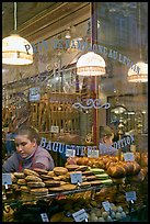 Woman selling pastries and bread in bakery. Paris, France ( color)