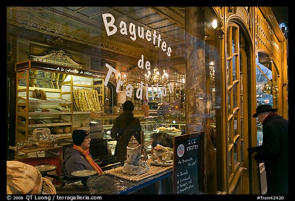 Elderly man entering bakery with people inside. Paris, France