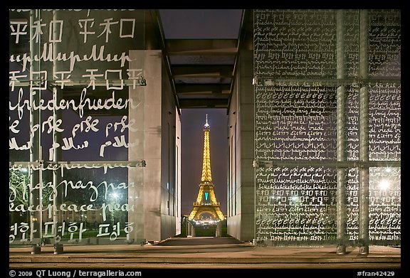 Monument to Peace framing the Eiffel Tower at night. Paris, France