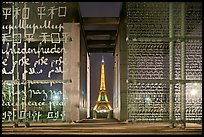 Monument to Peace framing the Eiffel Tower at night. Paris, France (color)