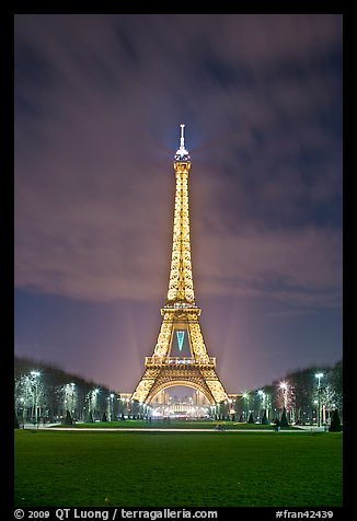 Lawns of Champs de Mars and Eiffel Tower at night. Paris, France