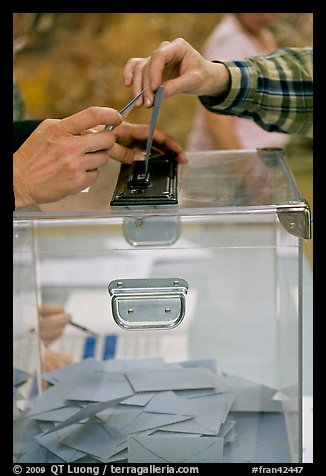 Ballot box with hands. Paris, France (color)