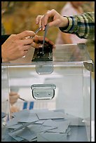 Ballot box with hands. Paris, France (color)