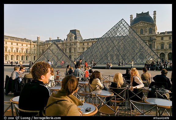 Cafe terrace in the Louvre main courtyard with glass pyramid. Paris, France (color)