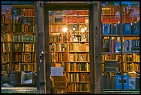 Books on shelves seen through storefront. Quartier Latin, Paris, France