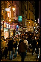 Busy pedestrian street at night. Quartier Latin, Paris, France (color)