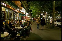 Cafe bar on sidewalk of a Grand Boulevard at night. Paris, France ( color)