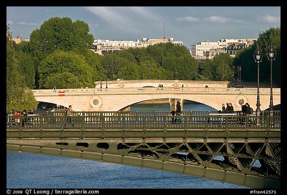 Steel and stone bridges over the Seine River. Paris, France