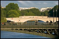 Steel and stone bridges over the Seine River. Paris, France
