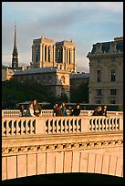 Watching the sunset from a bridge, with Notre Dame towers behind. Paris, France ( color)