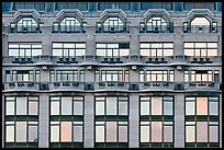 Glass windows of the Samaritaine reflecting colors of sunset. Paris, France ( color)