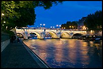 Quay, Seine River, and Pont-Neuf at night. Paris, France (color)