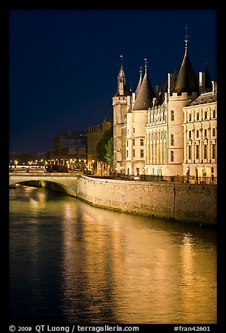 Conciergerie reflected in Seine river at night. Paris, France