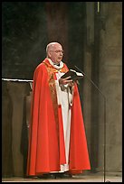 Cardinal of catholic church reading in Notre-Dame. Paris, France